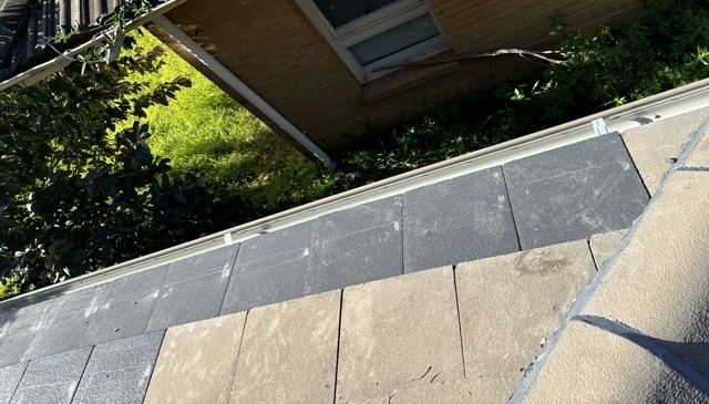 Tile roof restoration detail showing gutter line